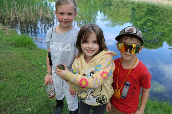 group of kids by the pond